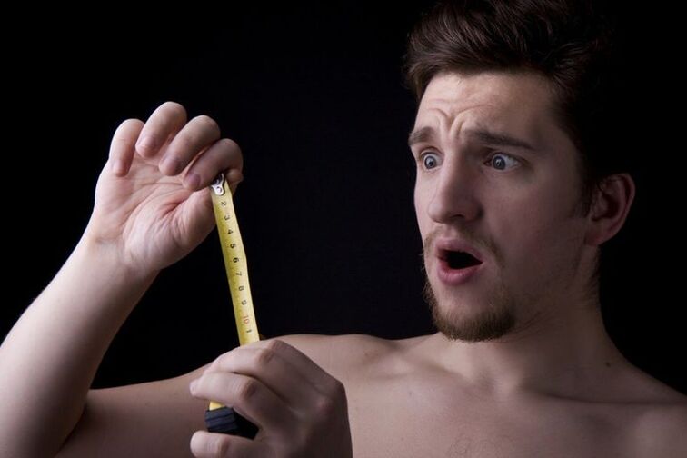 The man measures his dick before increasing the volume